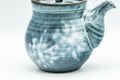 Another side angle of the teapot, showing the glaze and spout.