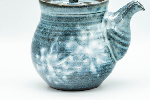 Another side angle of the teapot, showing the glaze and spout.