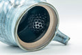 Overhead view with the lid removed, revealing the dark glazed interior and mesh strainer.