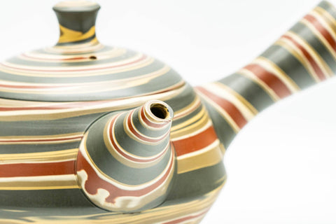 Japanese Kyusu - Green, Red, and Yellow Swirling Nerikomi Tokoname-yaki Do-ake Teapot - 240ml - angled view showing the nerikomi swirl pattern