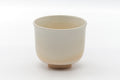 Side view of the matcha bowl showing the plainer beige glaze.