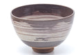 Larger front view of the brown hakeme chawan showing the rim and brushwork.