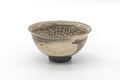 Front view of the mishima chawan showing the slip-inlay decoration and rim.