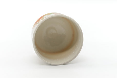 Overhead view into the bowl's pale beige glazed interior.