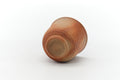 Hidasuki Bizen yunomi tilted to show the underside and small foot
