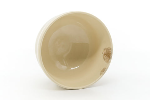 Overhead view into the bowl showing the smooth cream-glazed interior.