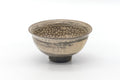 Mishima-style matcha bowl (chawan), front view, grey-brown body with white inlaid slip dot patterns near the rim.