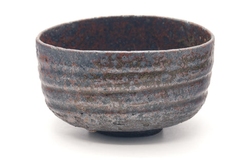 Larger front view of the chawan highlighting the ribbed surface and speckled glaze.
