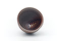 Overhead view looking into the dark interior of the cup.