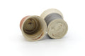 Tezumi — Japanese Teacups - Pair of Meoto Nerikomi Striped Yunomi — three-quarter view