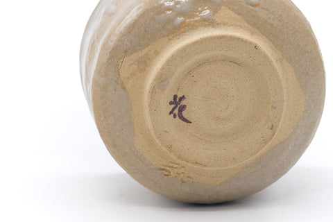 Underside of the chawan showing the foot ring and a small painted mark.