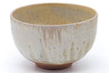 Wider side view showing the rounded form and vertical drip glaze.