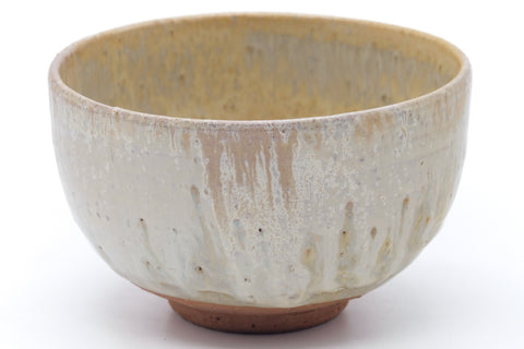 Wider side view showing the rounded form and vertical drip glaze.