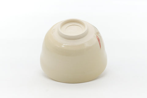 Underside of the bowl showing the trimmed cream foot ring.