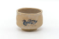Beige wabi-sabi chawan, front view painted with a blue-and-black duck.
