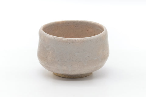 Front view showing the pale cream glaze and rounded rim.