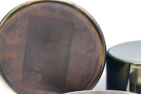 Overhead view of the tea canister showing the inner lid's flat top and the open mouth of the body