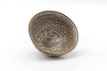 Overhead three-quarter view showing the stamped mishima pattern inside the bowl.