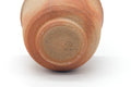 Close-up of the Hidasuki Bizen yunomi base, showing the foot and an impressed maker's mark