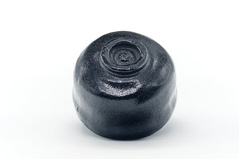 Underside of the raku chawan showing the spiral-carved foot ring.