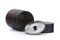 The canister opened, with the inner lid removed and the outer lid set beside it.