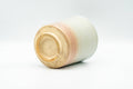 Beige, peach and white glazed Hagi-yaki yunomi teacup - view of the unglazed base and foot ring