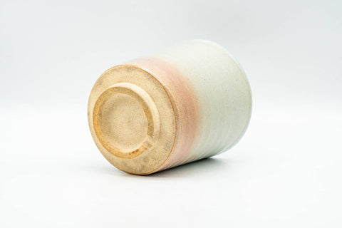 Beige, peach and white glazed Hagi-yaki yunomi teacup - view of the unglazed base and foot ring