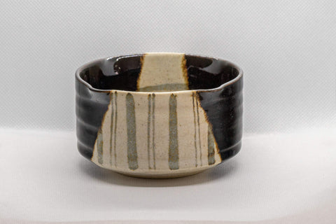 Japanese Matcha Bowl - Hantsutsu-gata Oribe Chawan - 250ml - three-quarter view of the matcha bowl showing the black and cream Oribe glaze