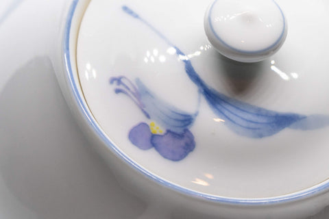 Tezumi — Japanese Kyusu - White Arita-yaki Porcelain Teapot with Blue Orchid decorations - 475ml — closeup of the decoration