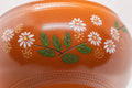 Japanese Kyusu - 帯アミ Floral Red Shudei Tokoname-yaki Obi-ami Teapot - 265ml - closeup of the body showing the white daisy and green leaf decoration