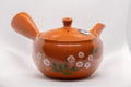 Japanese Kyusu - 帯アミ Floral Red Shudei Tokoname-yaki Obi-ami Teapot - 265ml - angled front view of the lidded teapot
