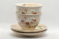 Japanese Teacups - Pair of Beige Floral Yunomi with Saucers - 150ml - the pair of cups stacked on their saucers