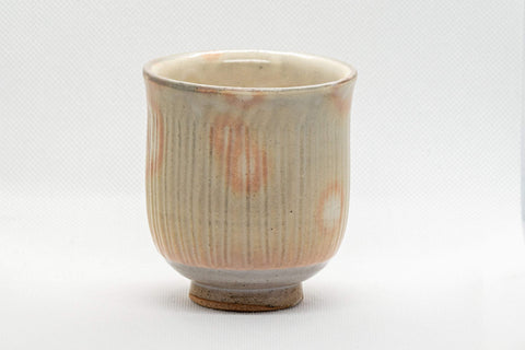 Japanese Teacup - Tachikichi Tsutsu-gata Yunomi - 210ml - side view showing the warm beige glaze with orange spots