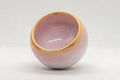 Japanese Teacups - Set of 5 Sakura Nagashi Wa-nari Guinomi - side view of a single cup showing the flowing pink hare's fur glaze