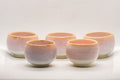 Japanese Teacups - Set of 5 Sakura Nagashi Wa-nari Guinomi - the five pink hare's fur glazed cups grouped together