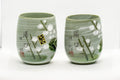 Japanese Teacups - Meoto Pair of Green Floral Yunomi - front view of the pair side by side with hand-painted floral decoration