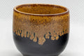 Japanese Teacup - Drip-Glazed Guinomi - 35ml - closeup of the amber drip glaze over the black exterior