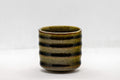 Japanese Teacup - Tsutsu-gata Yunomi - side view of the ribbed dark green crazed-glaze teacup