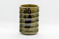 Japanese Teacup - Spiral Green Tsutsu-gata Yunomi - 130ml - side view showing the iron brown markings on the spiral glaze