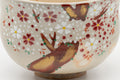 Japanese Matcha Bowl - Torasuke Kyo-yaki Komogai-nari Chawan - closeup of the painted red and white sakura blossoms