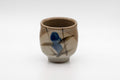 Japanese Teacup - Floral Yunomi - 140ml - three-quarter front view of the grey-brown cup with painted blue flower