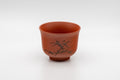 Japanese Teacup - Tokoname-yaki Senchawan - 100ml - three-quarter front view of the red clay senchawan with engraved flower