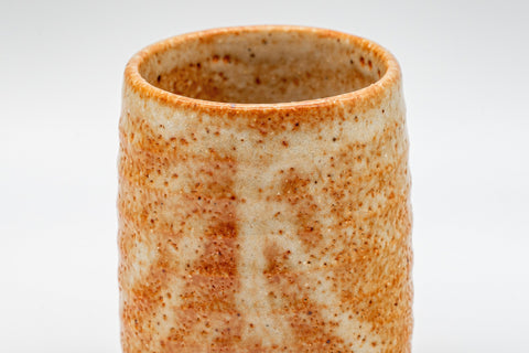 Japanese Teacups - Pair of Shino Glazed Tsutsu-gata Yunomi - 90ml - closeup of a single cup showing the ribbed orange shino glaze