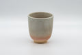 Japanese Teacup - Tsutsu-gata Hagi-yaki Yunomi - 140ml - front view of the cup showing the peach-toned base