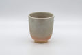 Japanese Teacup - Tsutsu-gata Hagi-yaki Yunomi - 140ml - front view of the grey-glazed Hagi-yaki cup