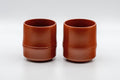 Japanese Teacups - Pair of 亮泉 朱泥 Tsutsu-gata Tokoname-yaki Yunomi - 140ml - front view of the pair of bamboo-shaped cups