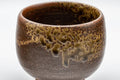 Japanese Teacup - Dark Brown Glazed Yunomi - 145ml - closeup showing the dark green ash glaze dripping over the brown glaze