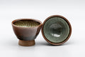 Japanese Teacups - Pair of Tenmoku Glazed Sugi-nari Guinomi - 55ml - the pair with one cup tilted to show the speckled green interior