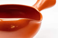 Tezumi — Japanese Yuzamashi - Red Shudei Tokoname-yaki Water Cooler - 350ml — closeup of the glaze