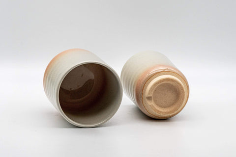 Tezumi — Japanese Teacups - Couple's Pair of Tsutsu-gata Hagi-yaki Meoto Yunomi — tipped to show the interior